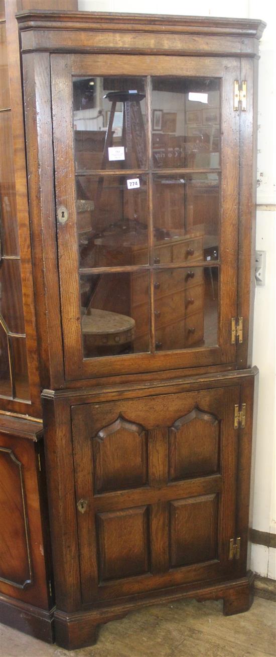 Penelled oak standing corner cupboard(-)